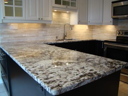 Ultra Premium kitchen with tile backsplash, granite counter and new cabinets with LEDs.