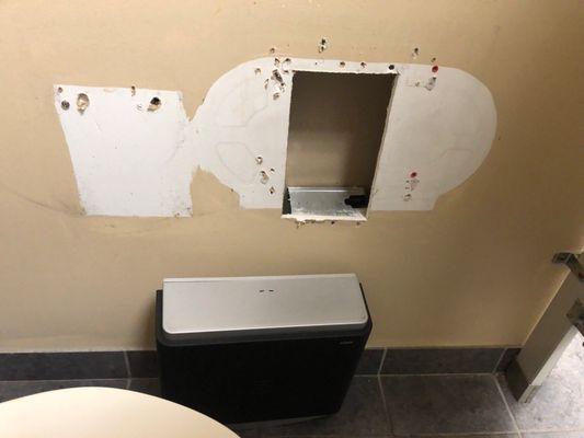 Toilet paper dispenser in women's restroom has been down for several months.