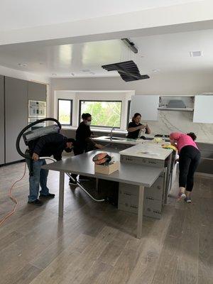 JJ & CC Post Construction Cleaning - Wiping down kitchen surfaces