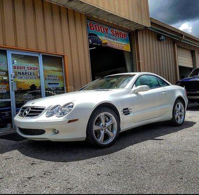 FRONT VIEW OF THE SHOP WITH A CUSTOM SATIN PEARL WHITE MERCEDES SL AMG WE RESTORED FOR A CUSTOMER IN 2016