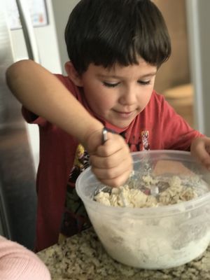 Helping make morning breakfast