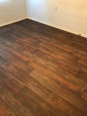 Linoleum flooring - much less expensive than real wood and looks fantastic!