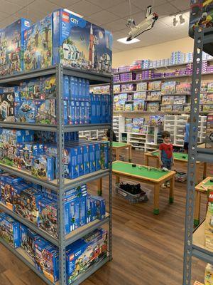 The play area with 6 tables. Surrounded by every Lego set.