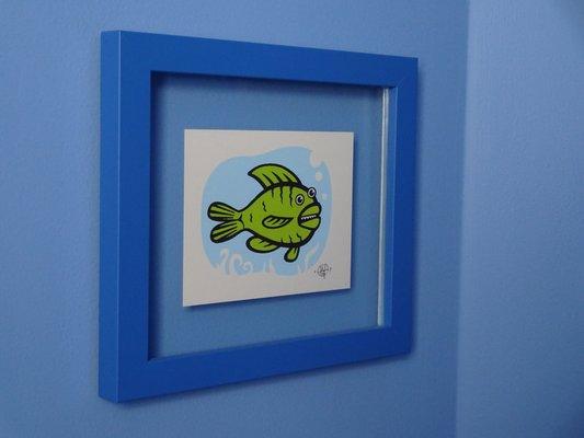 This little fish print is floating in the frame. Makes for a cool effect in person.