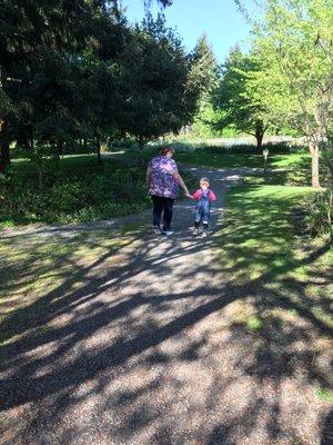 Walking down shady path.