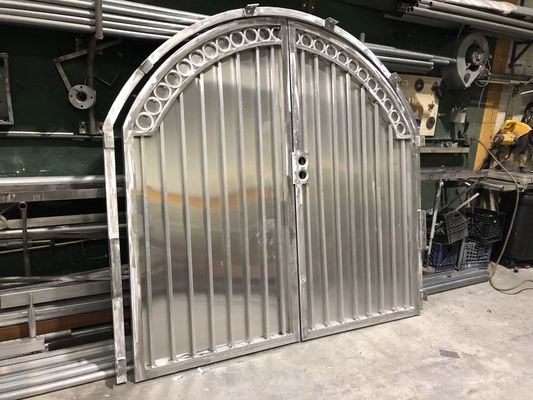 Side entry double door gate with an arch finish