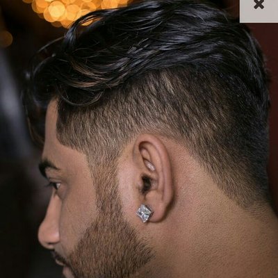 Omar has a clean undercut with soft layers in the top.