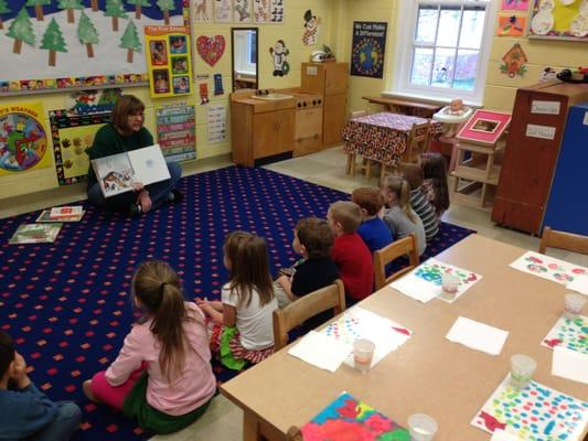 4's teacher reading a captivating story.