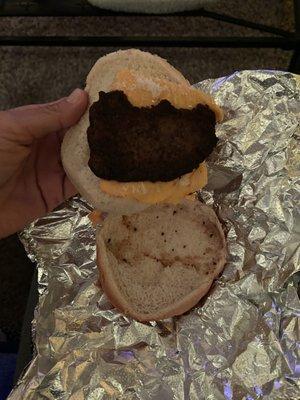 Ordered a burger cookout style, and this is what I got. Please tell me why the patty has 2 chunks missing from it.