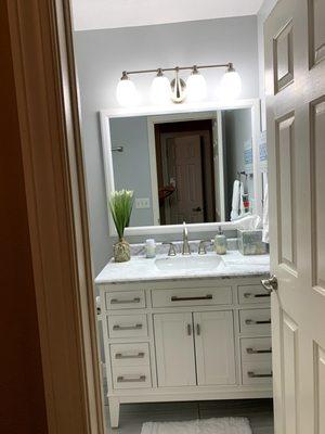 Guest bathroom renovation 
 New vanity, sink, hardware, mirror, paint and tile flooring