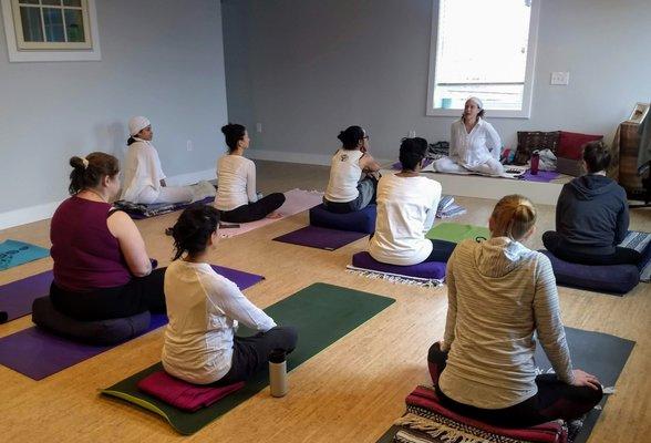 Owner, Julie (Jiwan Shakti Kaur) hosting the inaugural Kundalini class. The new location just opened March 9!