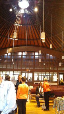 Light streams I  through windows in the circular roof. A wall of Windows let you look straight through the space.