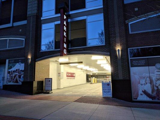 Entrance to parking deck on 11th St NE at nighttime.