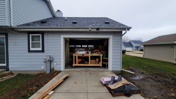 opened back of existing attached garage to drive thru to addition.