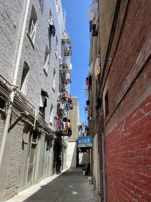 Laundry hung in Chinatown alley - where years ago there was gambling hall