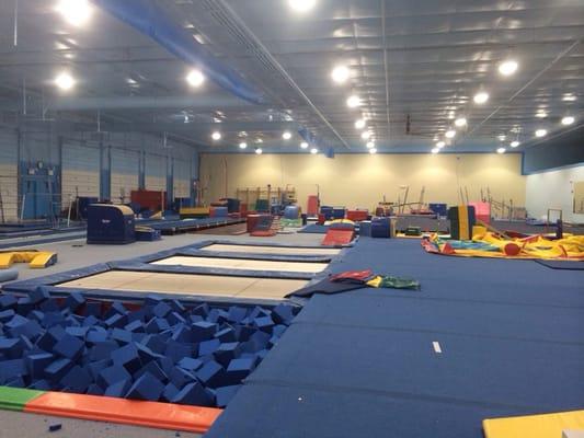 Trampolines, tumble track. Foam pit, zip line, and also, huge balance beam, bars, and ring areas.