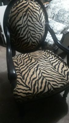 Upholstered chair needing reupholstering