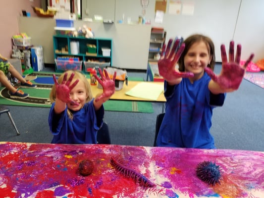 Sisters painting together