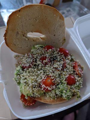 Toast avocado toast (surprised it was a bagel) with tomato, hemp seed, and bagel seasoning.