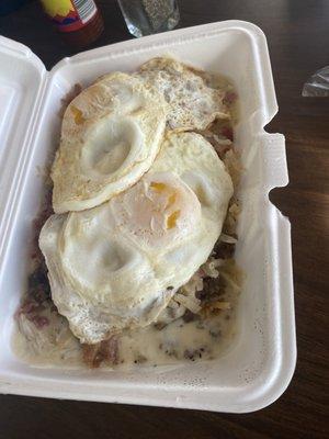 Loaded biscuits and gravy with all the meats & hashbrowns.