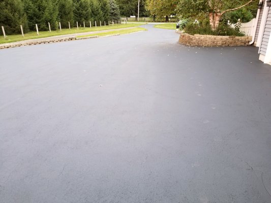 View of the driveway after seal coating. Todd's did a great job!