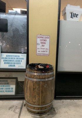 Cute barrel trashcan outside