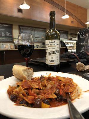 Bow tie pasta, red, yellow peppers, onions, garlic, olive oil, white wine, olives, Italian sausage, red sauce. bread. Altos de La Hoya wine.