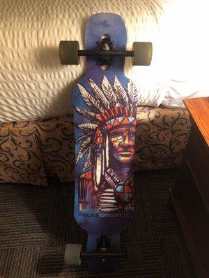 Arbor Catalyst 38 Longboard with Sector 9 trucks and wheels.