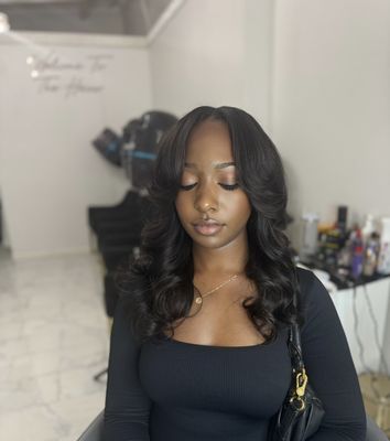 Traditional sewin middle part with curls