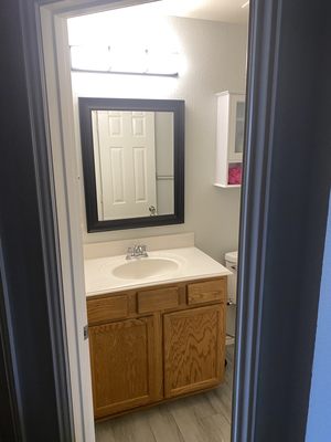 Before picture of a guest bathroom cabinet and sink