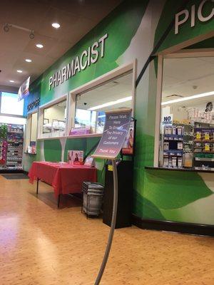 Pharmacist inside with seating area.