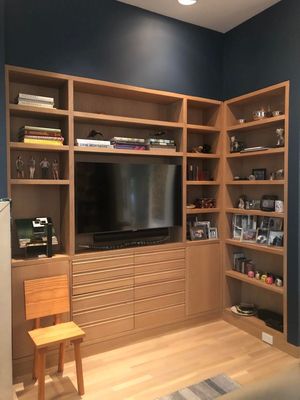 Mounted TV in a unique corner nook with a LCR speaker.