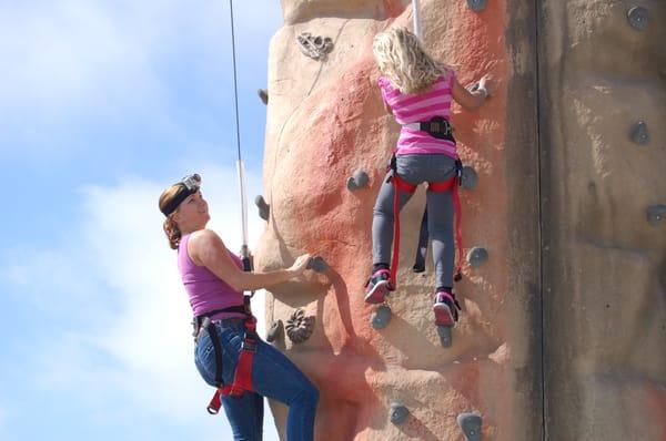 Producer, Regan Eymann, shooting with GoPro on the Extreme Engineering Rock Wall at the Santa Cruz Beach Boardwalk