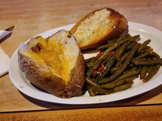 Green beans, loaded baked potato with butter, cheese, & bacon (I held the sour cream), and garlic bread