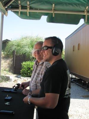 Instructor J helping load magazines.