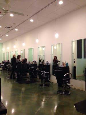 Customers are getting the finishing touches while chatting with the stylists.