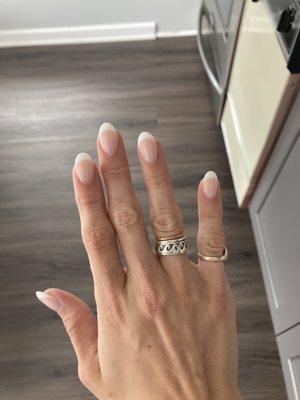 Nude french powder extensions with almond tip by Vanessa