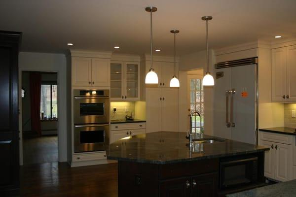 Large granite island in the middle of this Scarsdale kitchen.