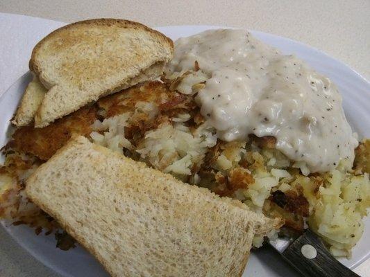 Yep, there are two eggs and a large chicken fried steak under all those crispy hash browns.