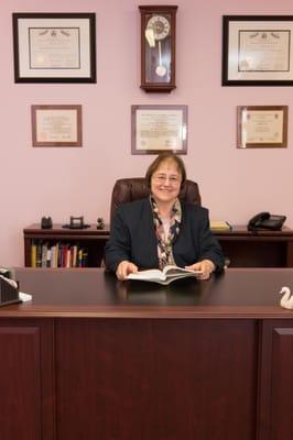 Peggy uses books to enhance clients' counseling experience.