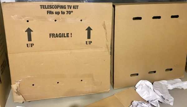 The TV packing box. The crushed corner in lower left had a piece of paper taped over it apparently to hide the damage.