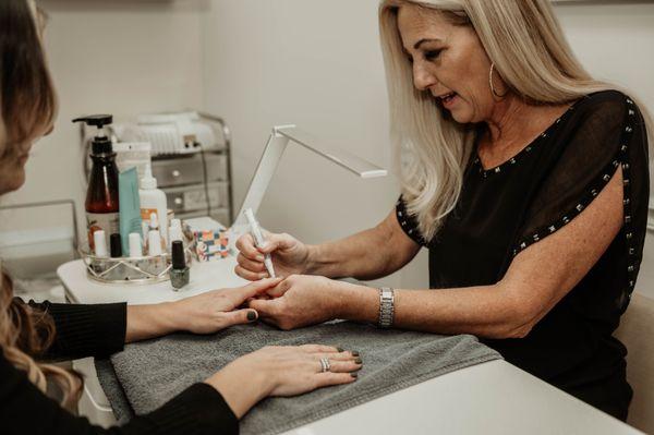 Patty doing manicure with dazzle  dry polish