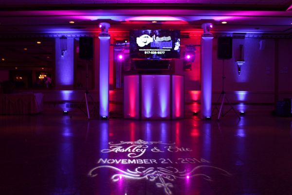 Wedding DJ Setup. Lights, name in lights and TV.