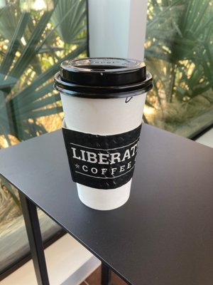 Cafe latte in a to-go cup.