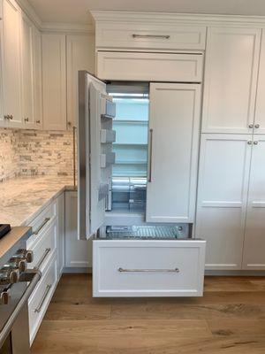 Custom cabinet panels on this SubZero French door refrigerator create a beautiful look that flows with the cabinetry in the space.