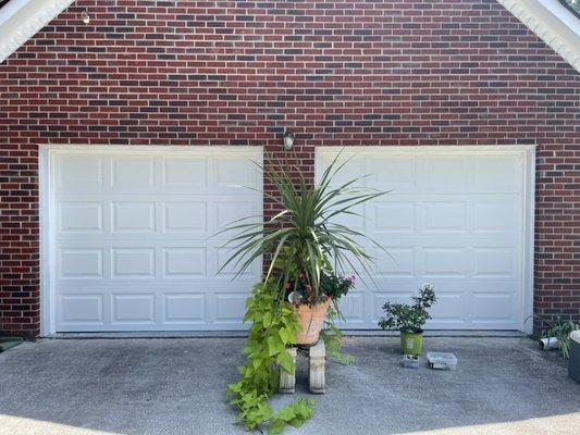 Let's get rid of those old wooden doors! 
And let's replace them with any style and color Quality built Garage Doors of your choice.