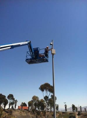 One of our team members inspecting a new camera installed at the US/Mexico border.