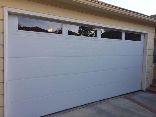 Smooth Garage door with clean glass windows