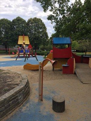 Cool park. The ground has rubber mat all over so good safety feature for kids. They also have a lot of sand to play with.