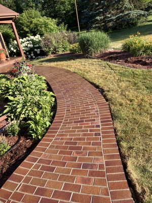 New concrete sidewalk with thin brick